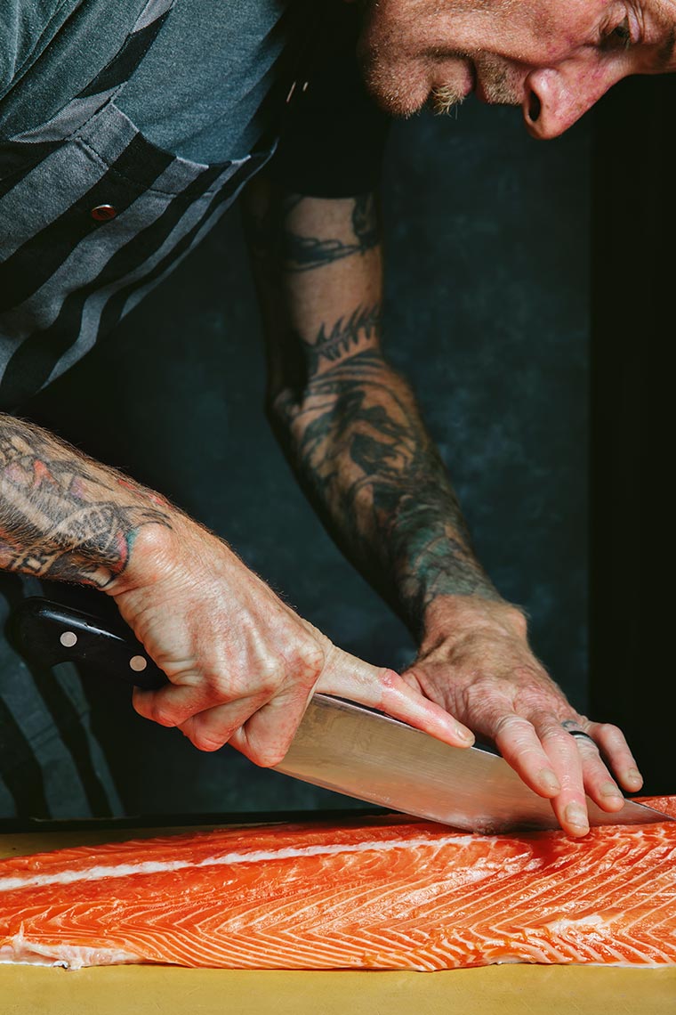 Chef Davin Waite preparing salmon